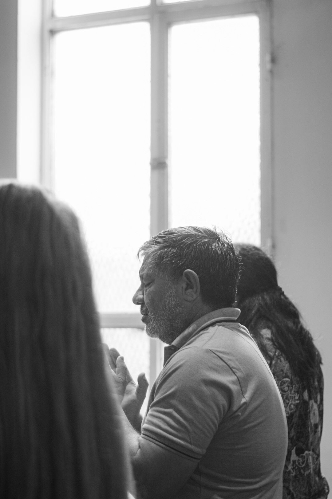 Group practicing a negotiation role-play exercise in a training room